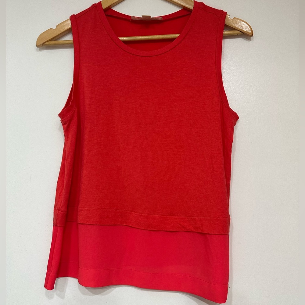 Michael Kors Coral sleeveless tiered blouse. It is a layered top